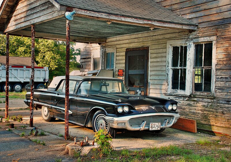 Old car under a porch