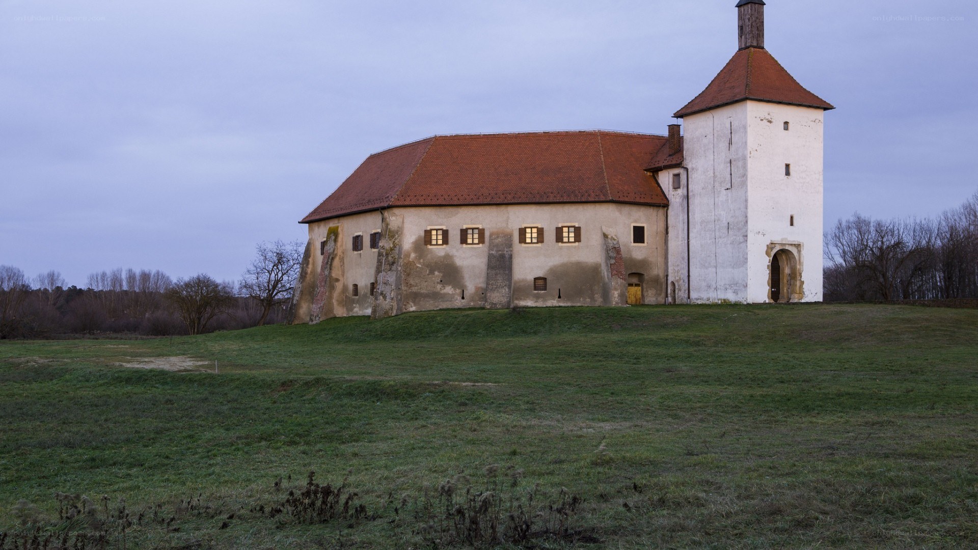 Old castle on a grassy hill