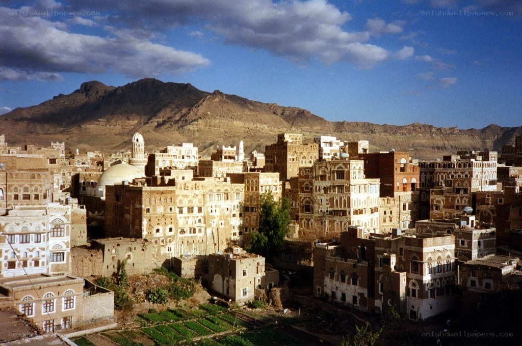 Old city with mountains in background
