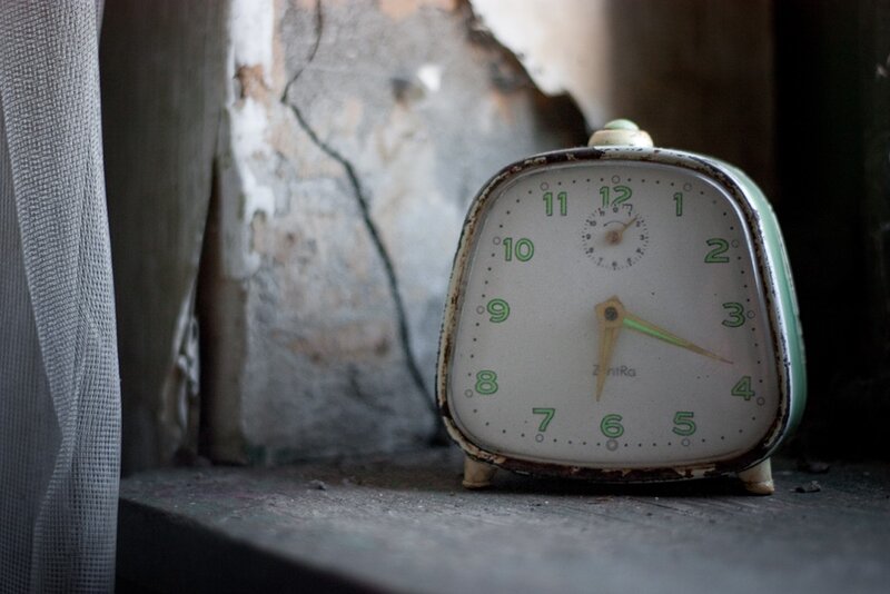 Old clock on a windowsill