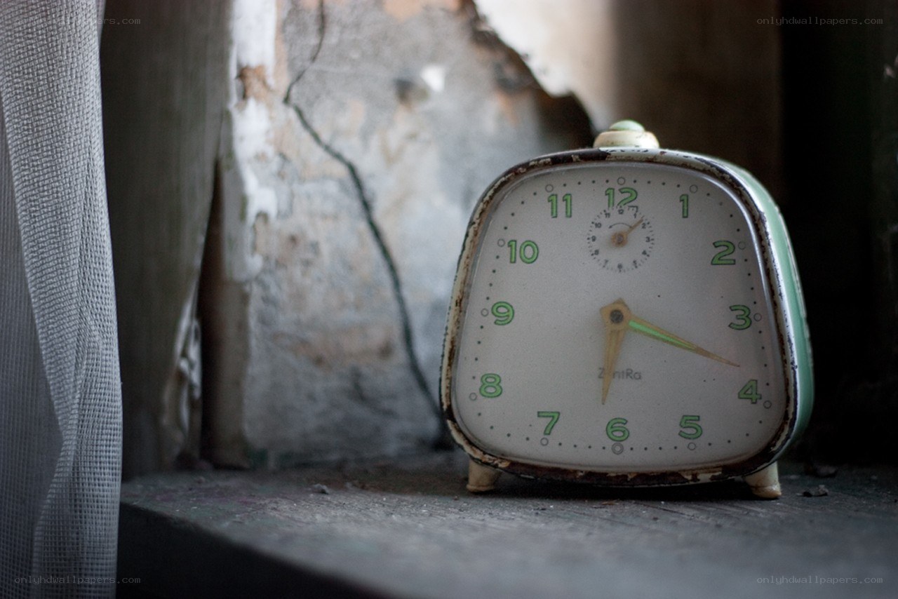 Old clock on a windowsill