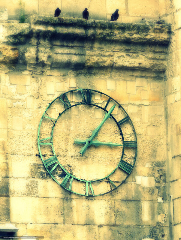 Old clock on stone wall
