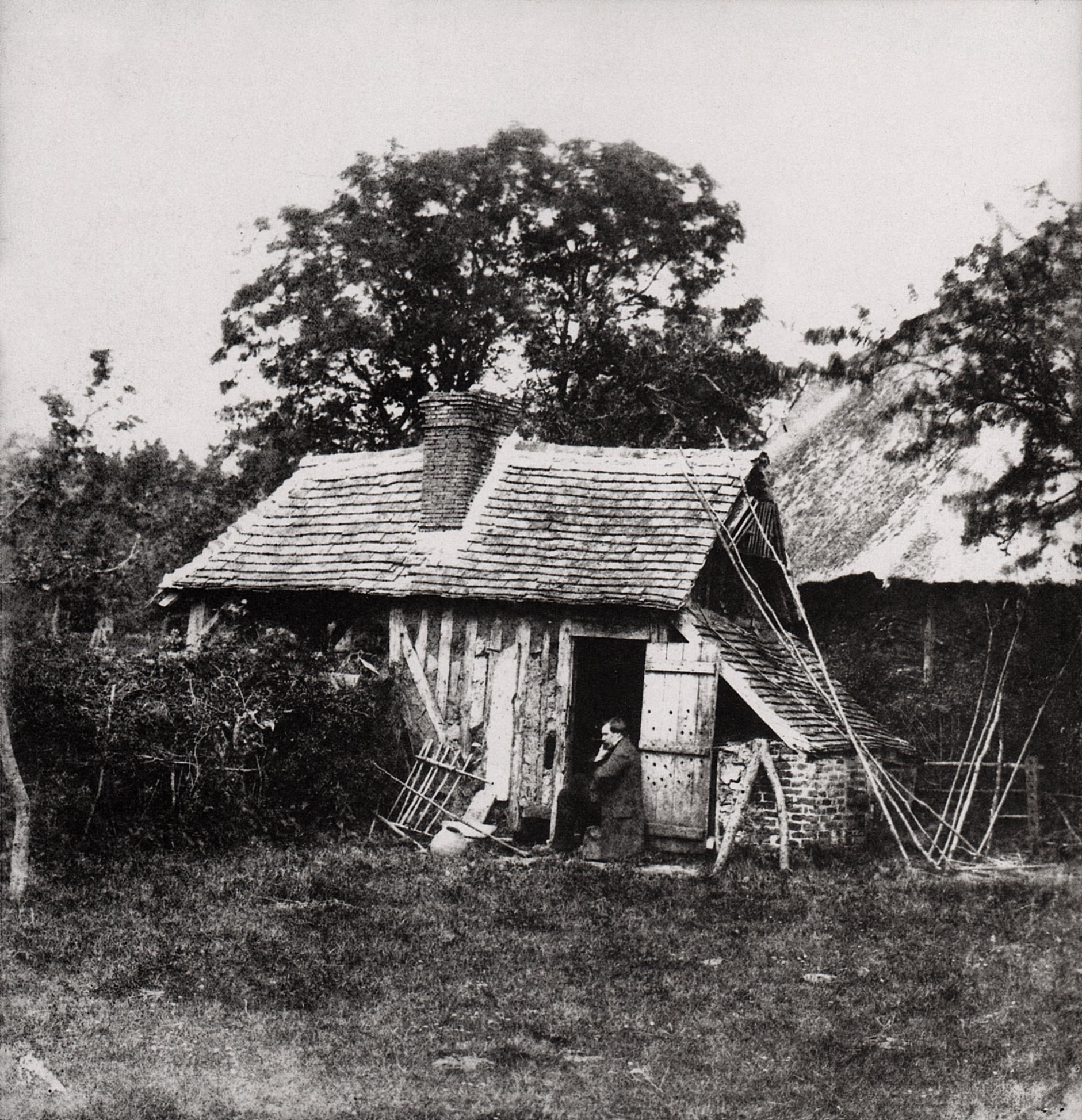 Old cottage with man at door