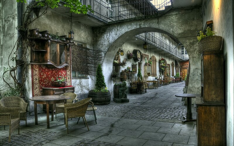 Old courtyard with tables and arches