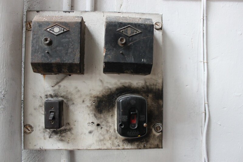 old electrical panel on wall