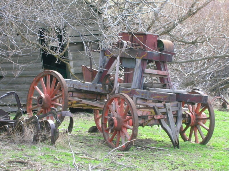 Old farm equipment in grass
