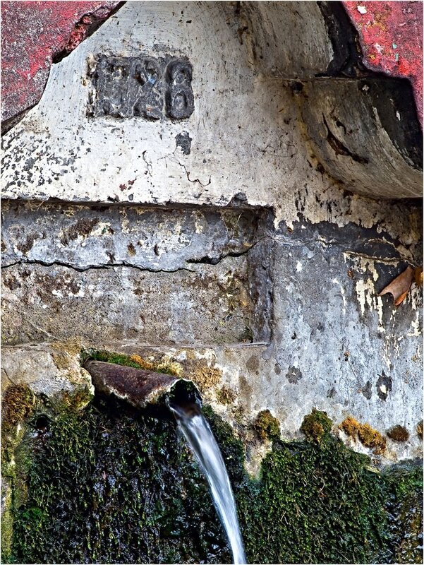 old fountain with flowing water