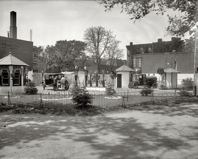 Old gas station with vintage cars