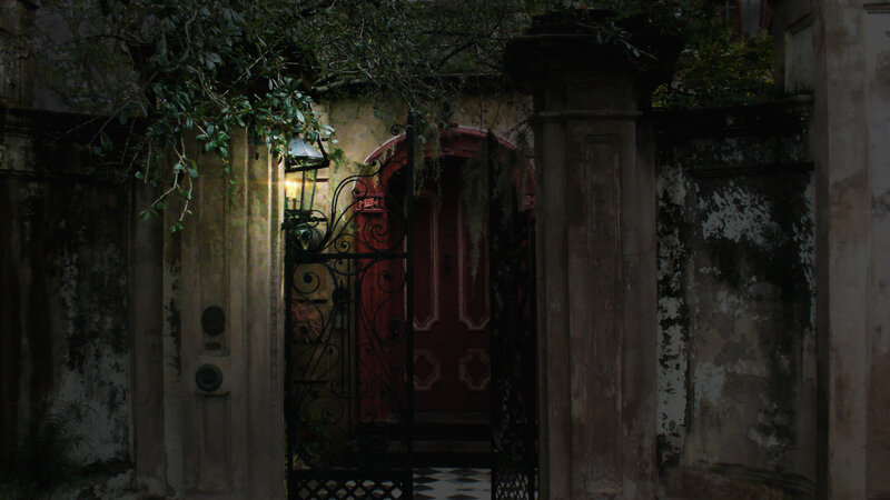 old gate with red door