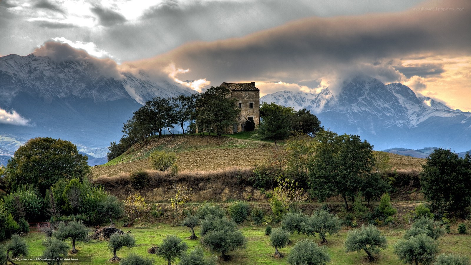 Old house on a hill with mountains