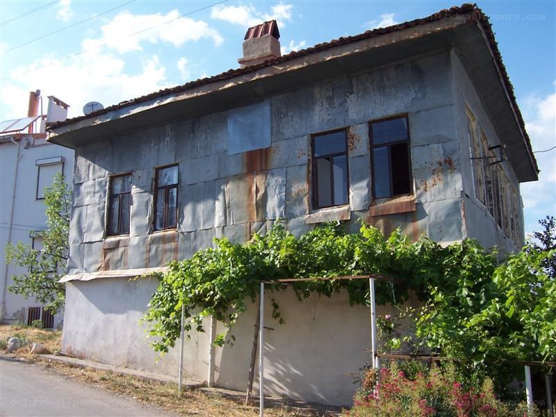 Old house with metal siding