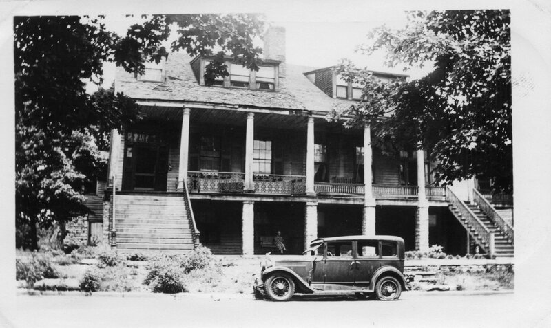 Old house with vintage car