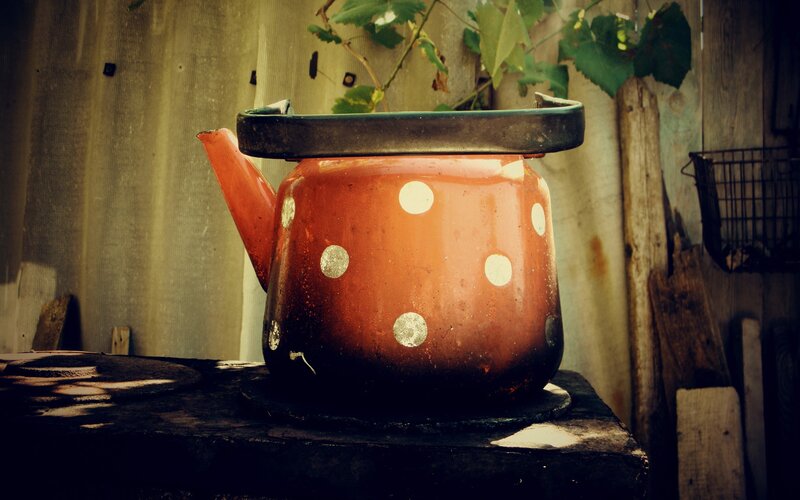 Old kettle on a rustic stove