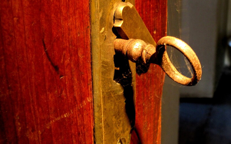 Old Key in Wooden Door