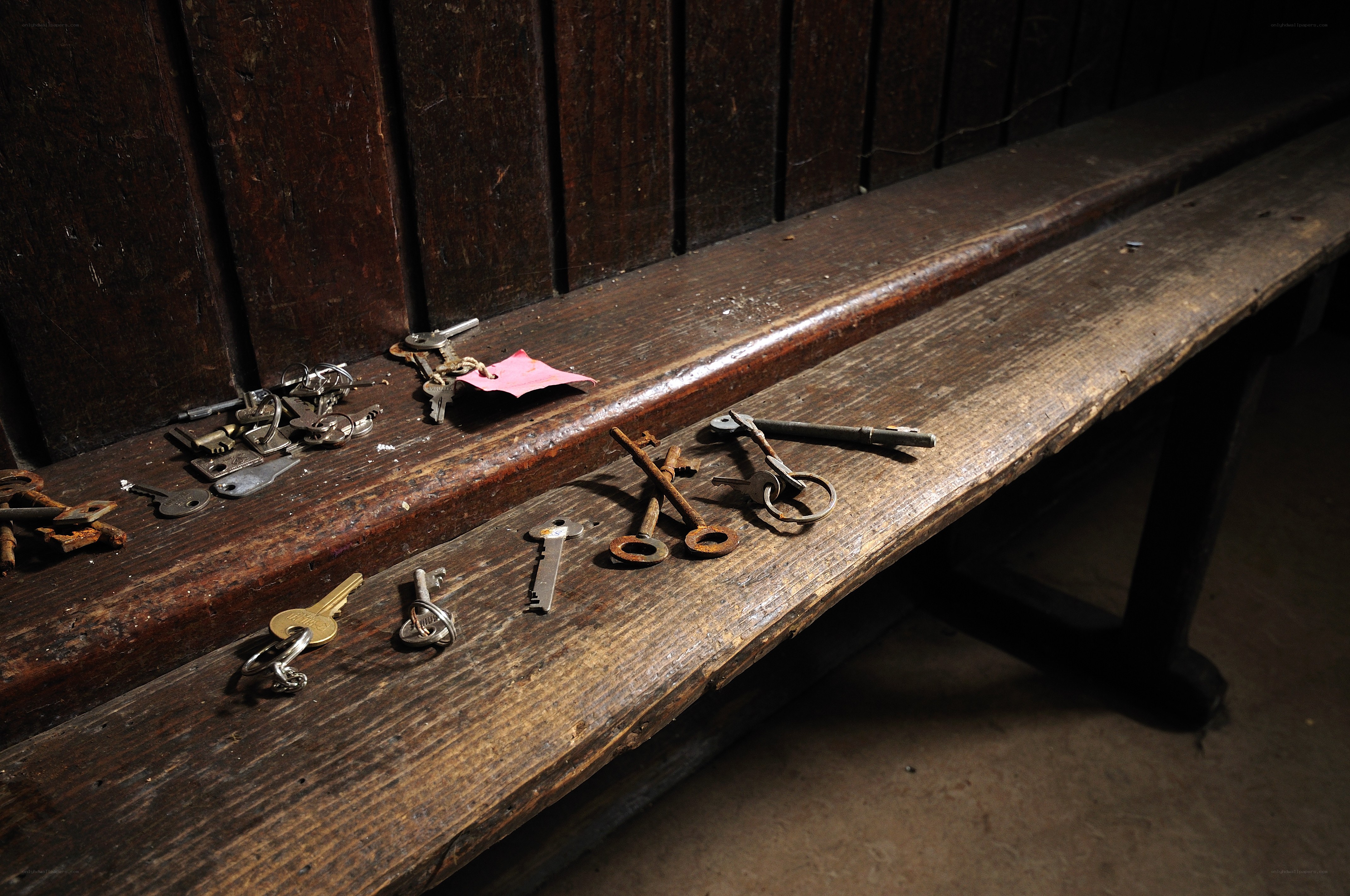 Old keys on wooden bench