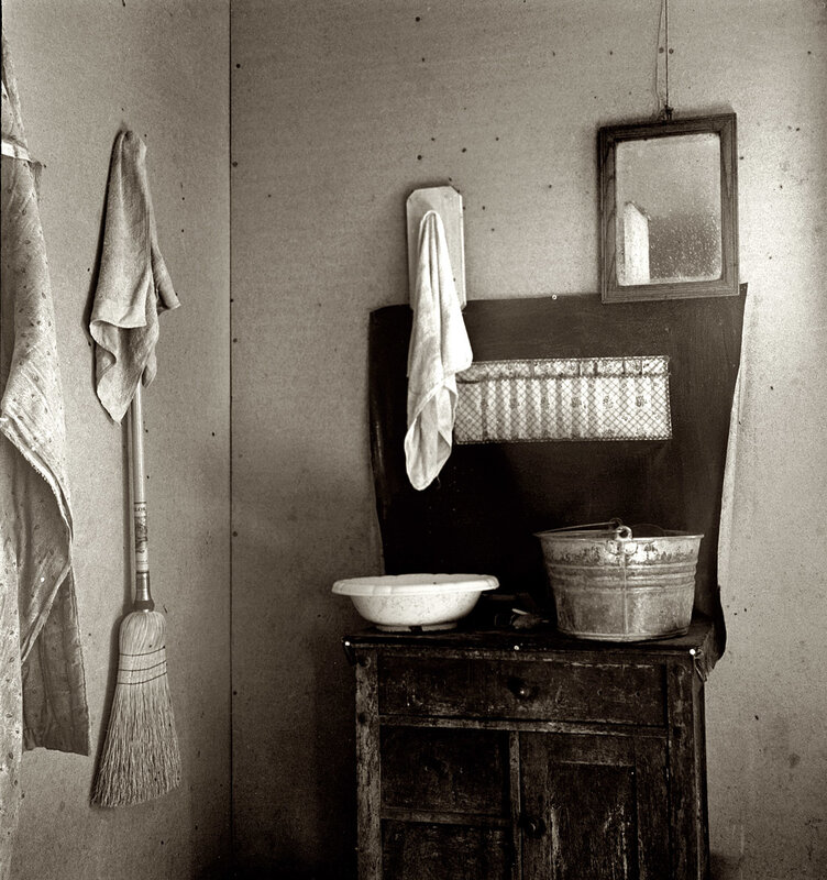 Old kitchen corner with broom and basin