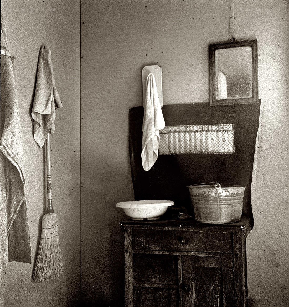 Old kitchen corner with broom and basin