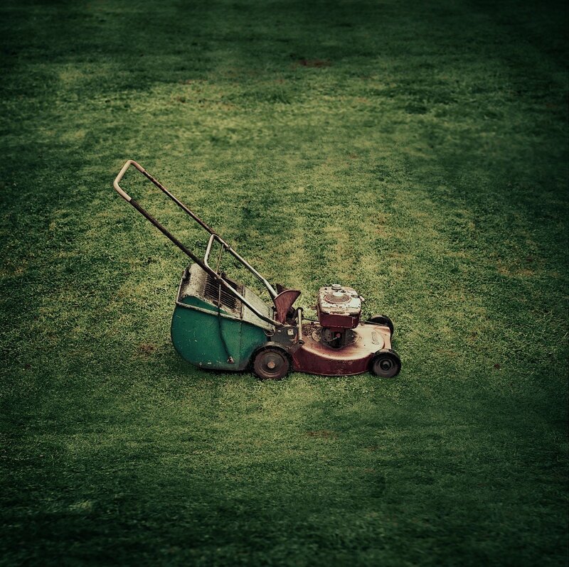 Old lawnmower on grass