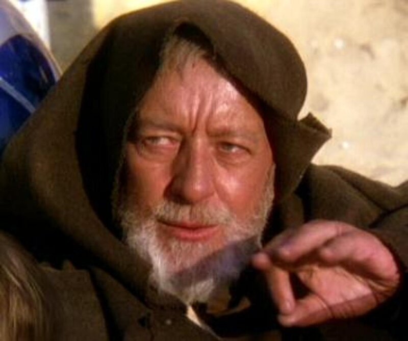 Old man in hooded cloak
