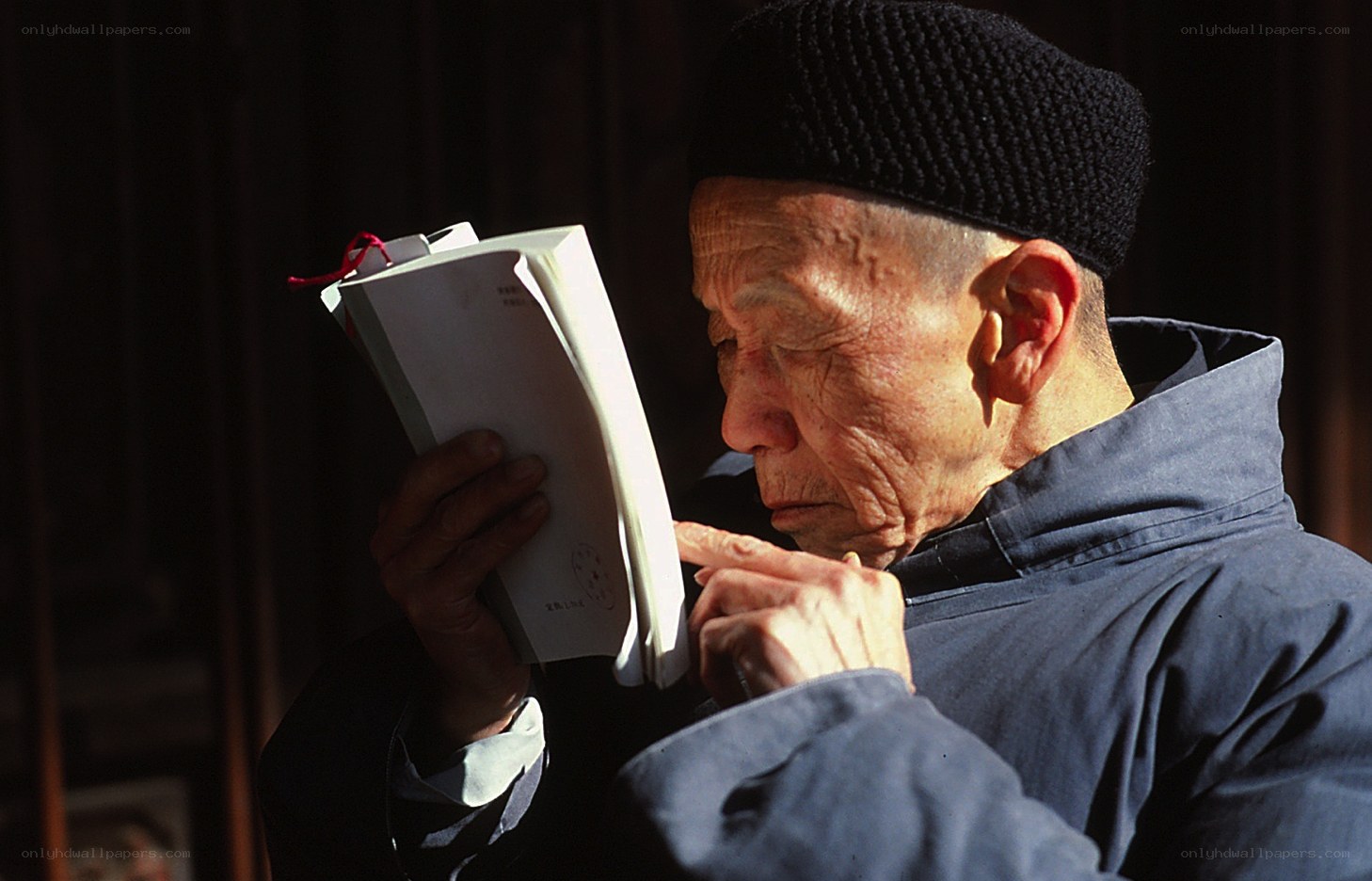 Old man reading a book