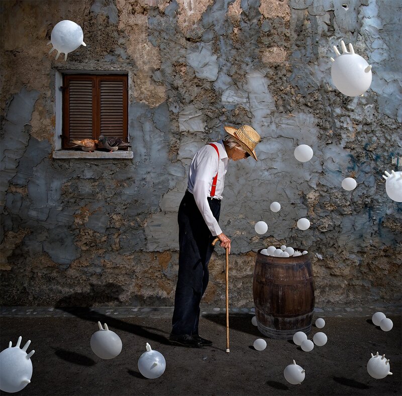 Old man with white spheres