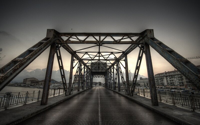 Old metal bridge over harbor