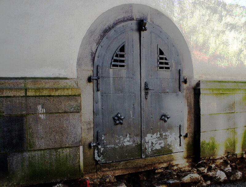 Old Metal Door in Stone Wall