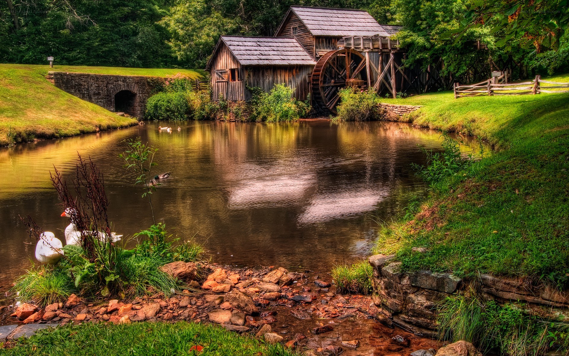 Old mill by a serene pond