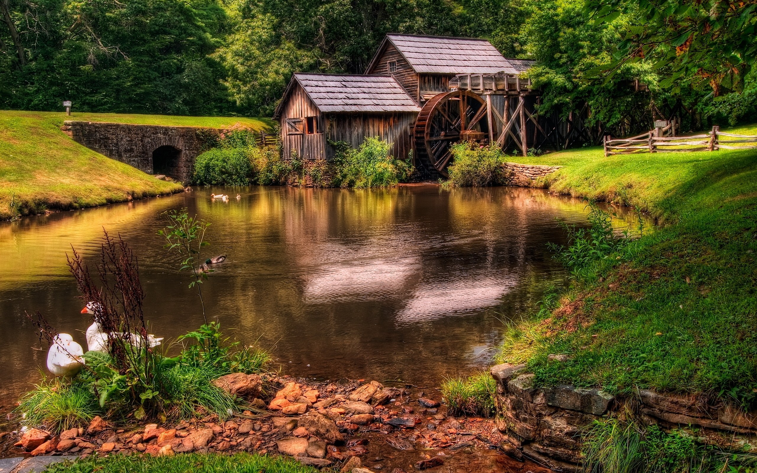 Old mill by a serene pond