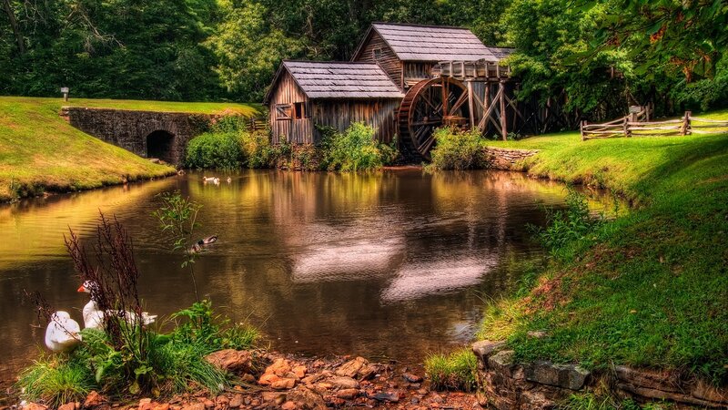 Old mill by a serene river