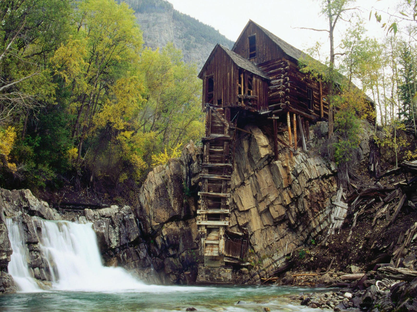 Old mill by a waterfall