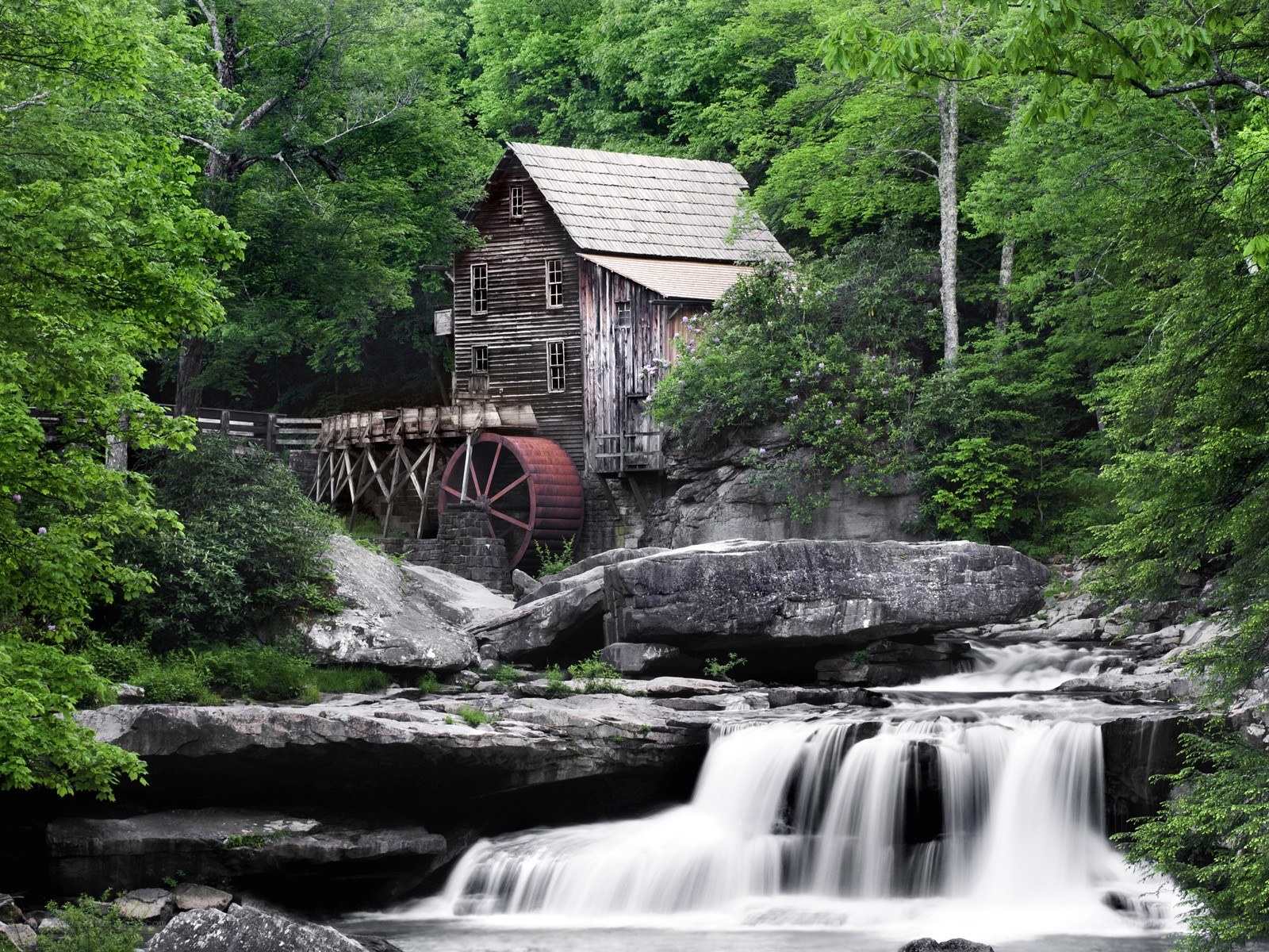 Old mill by a waterfall