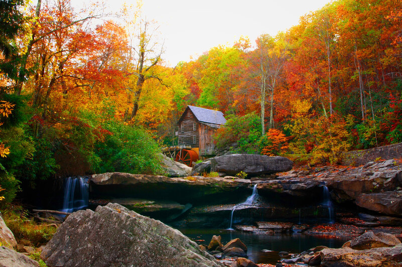 Old Mill by Waterfall — Orange, Serene, Autumn, Photograph, Fallen Leaves