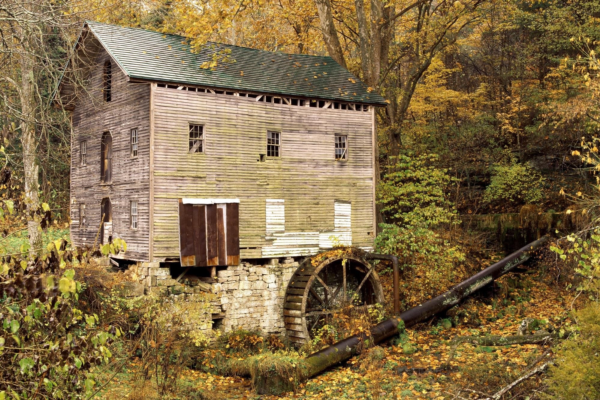 Old mill in autumn forest