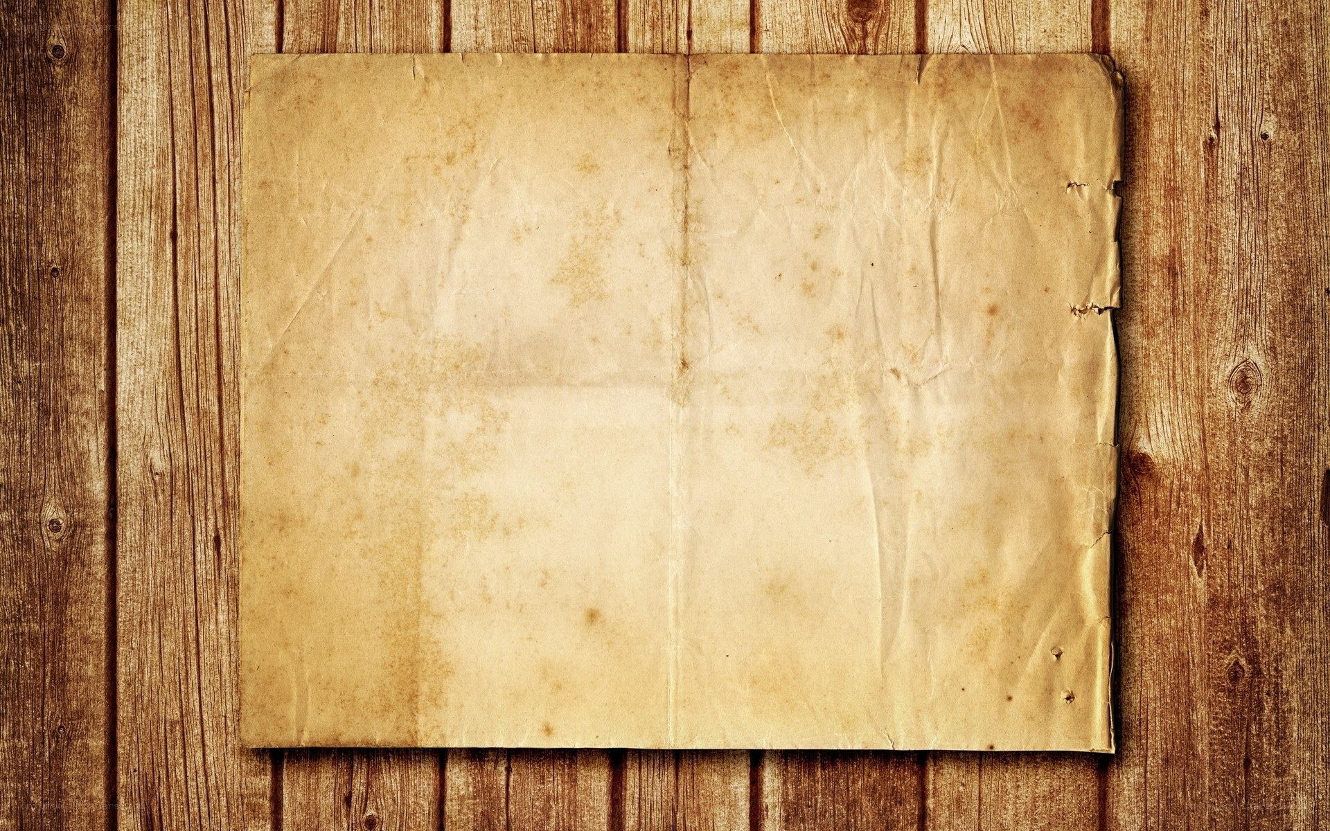 old paper on wooden wall