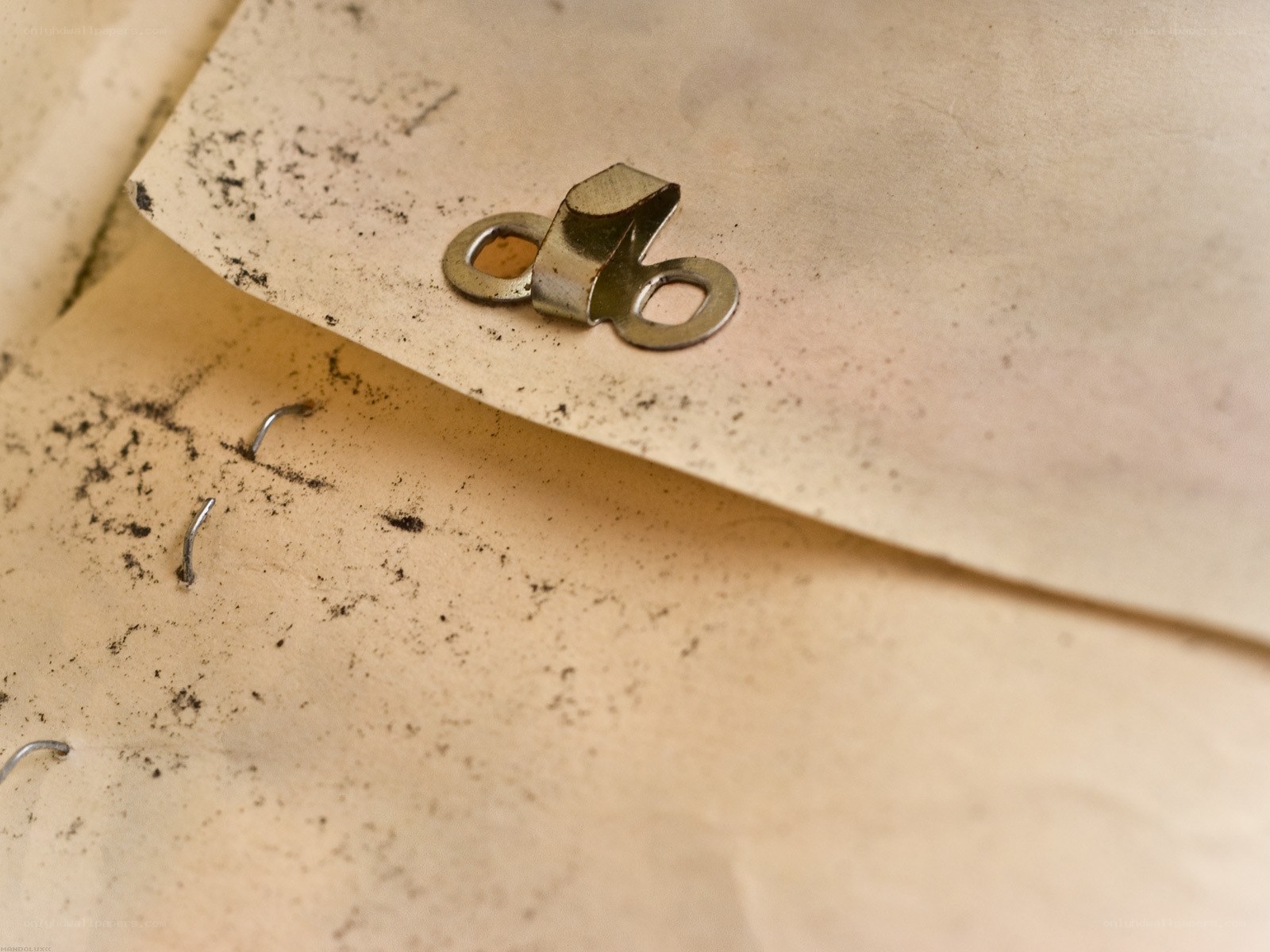old paper with metal fasteners