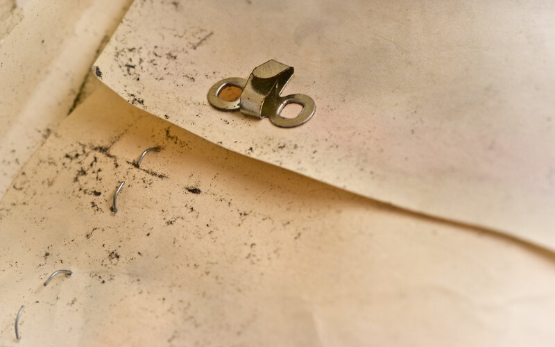 old paper with metal fasteners