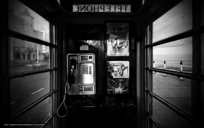 Old phone booth by the sea