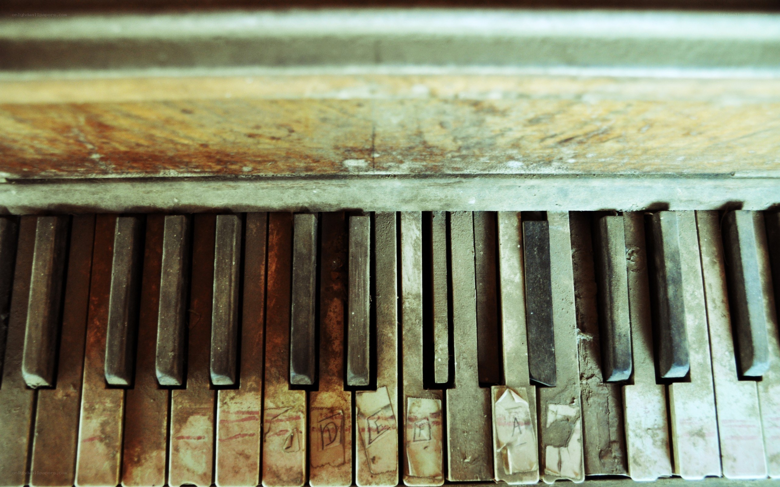 old piano keys with graffiti