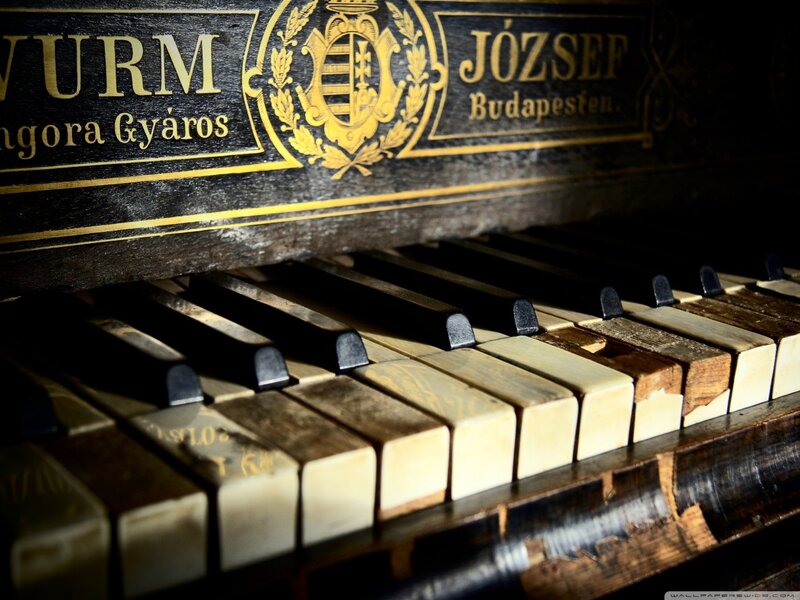 old piano with worn keys