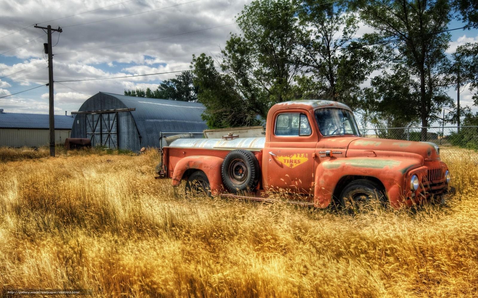 Old red truck in a field
