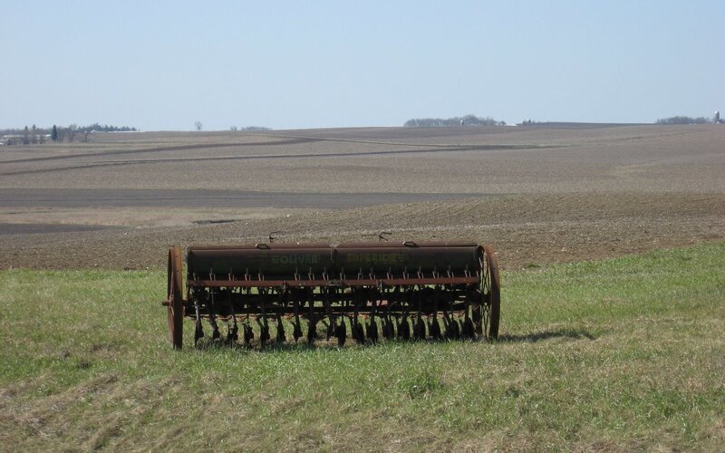 Old seeder in a field