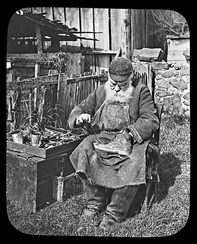 Old shoemaker at work