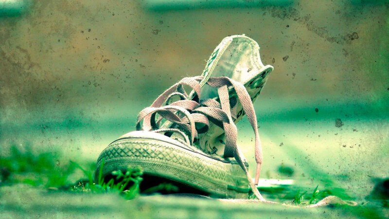old sneaker on grass