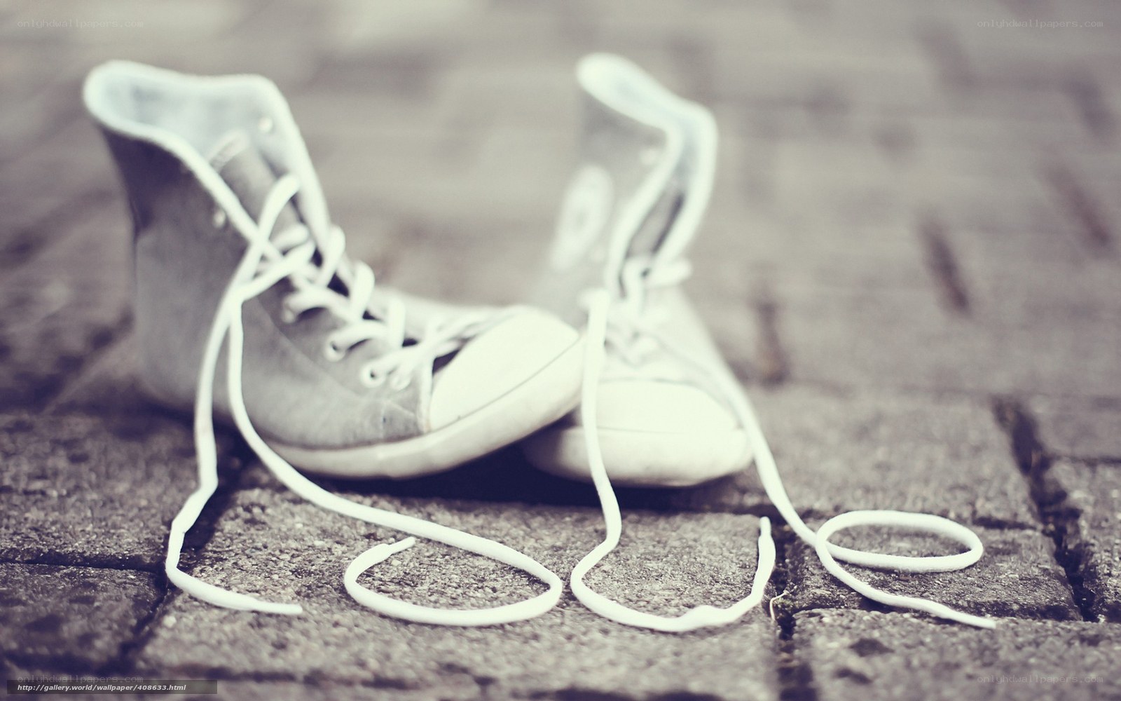 Old sneakers on pavement