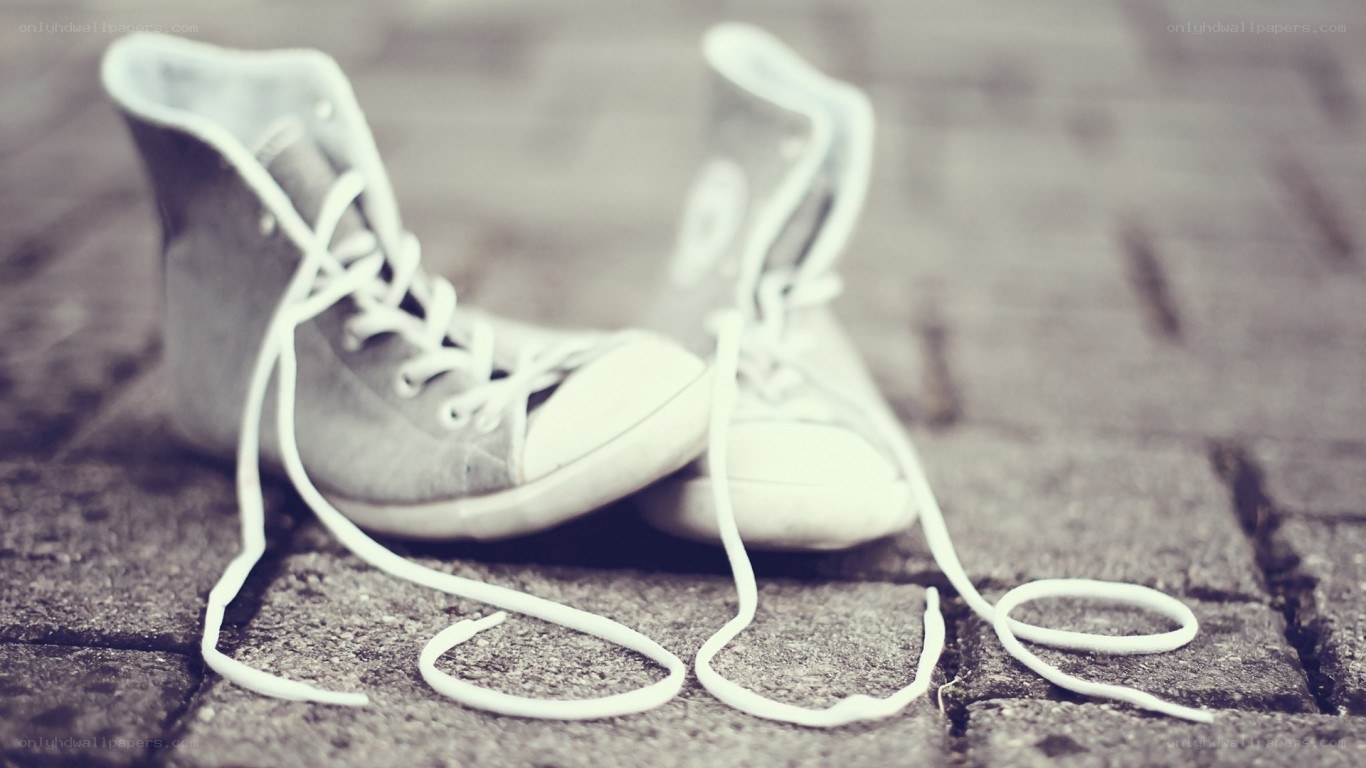 old sneakers on pavement