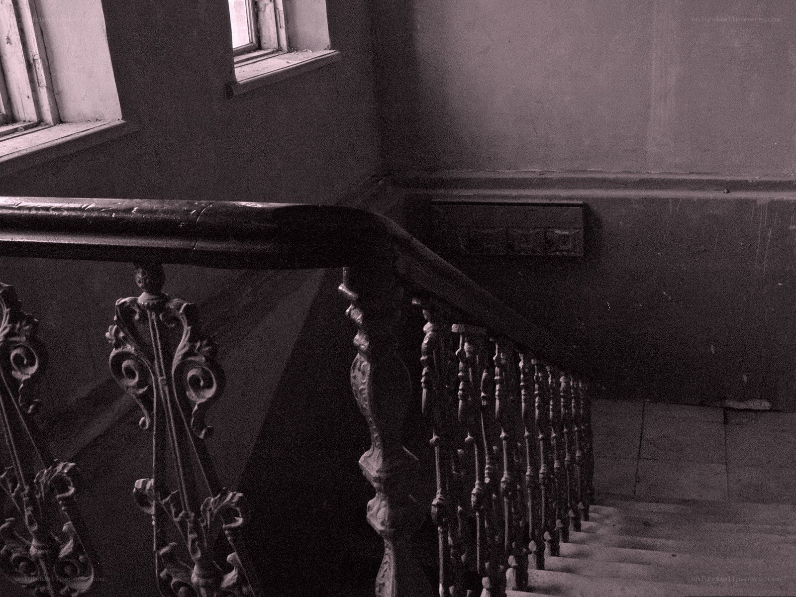old staircase with ornate railing