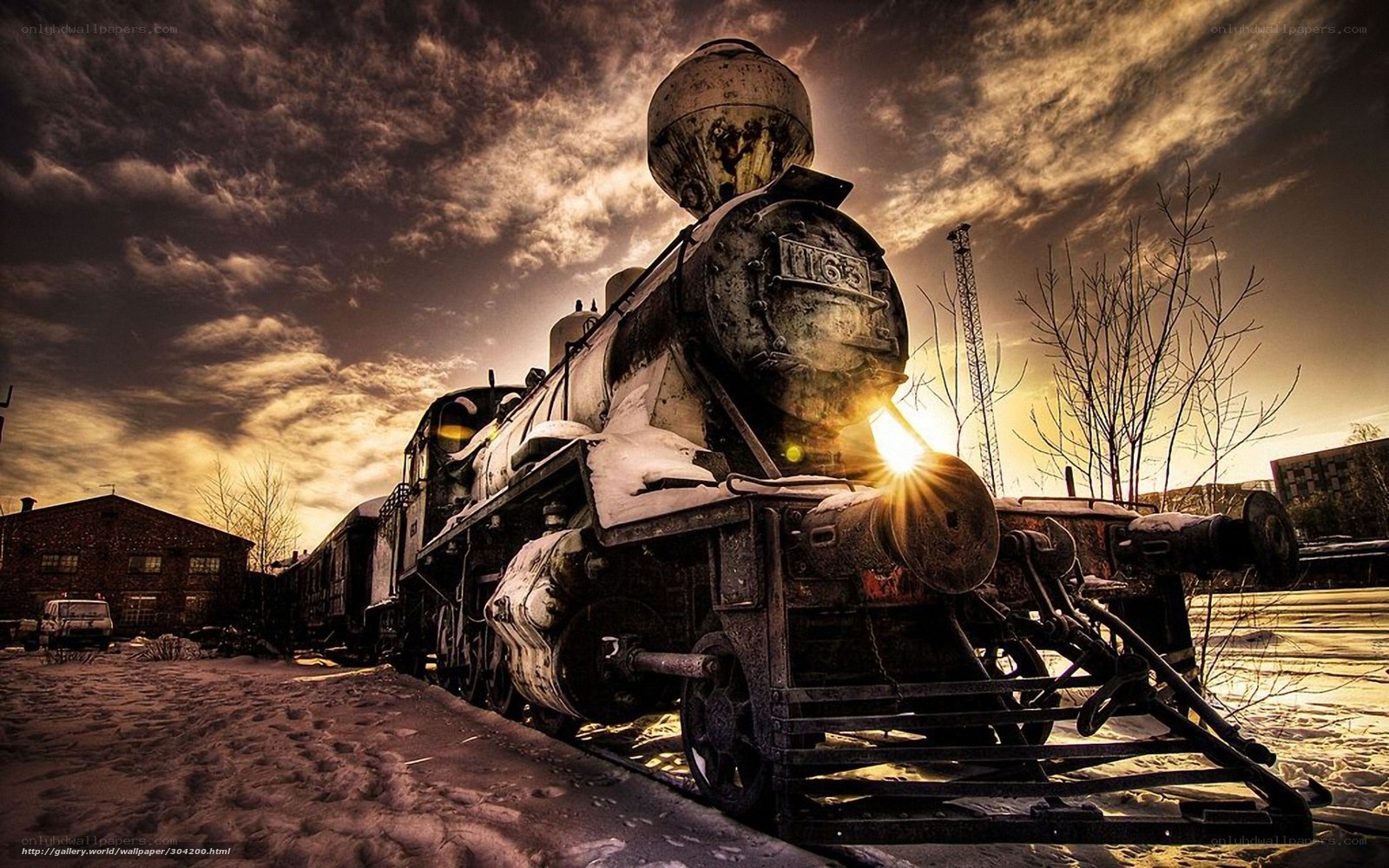 Old steam locomotive at sunset