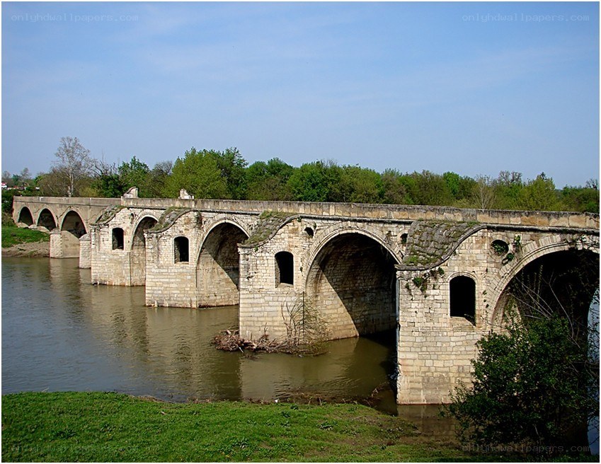 Old stone bridge over river