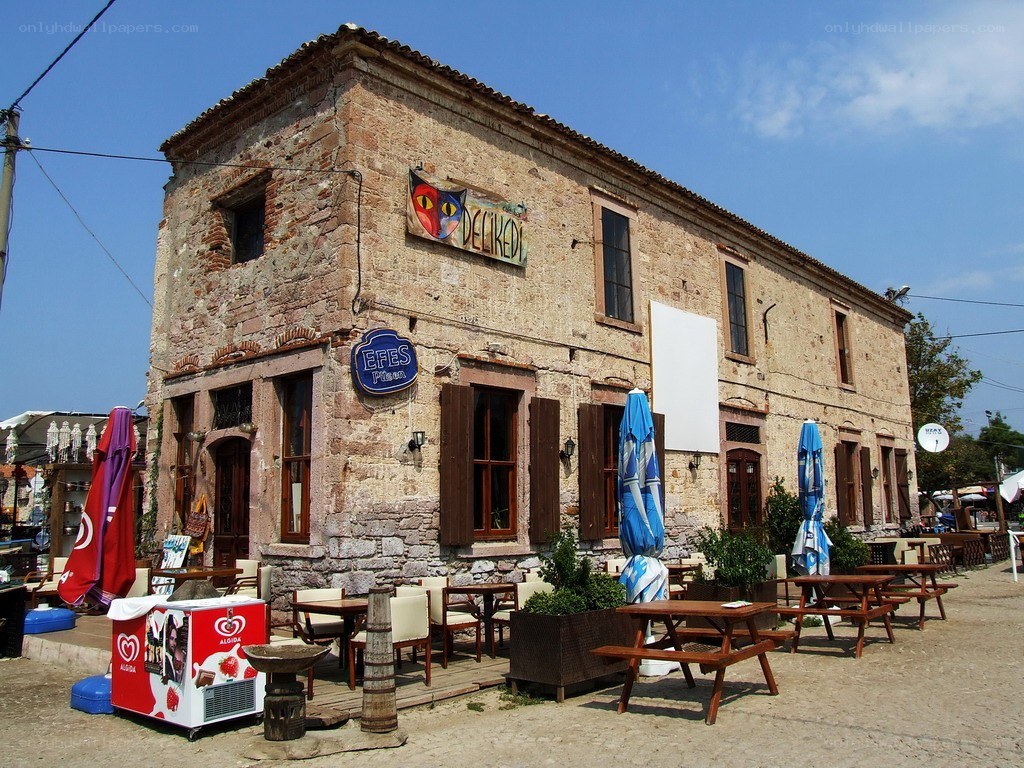 Old stone building with outdoor seating